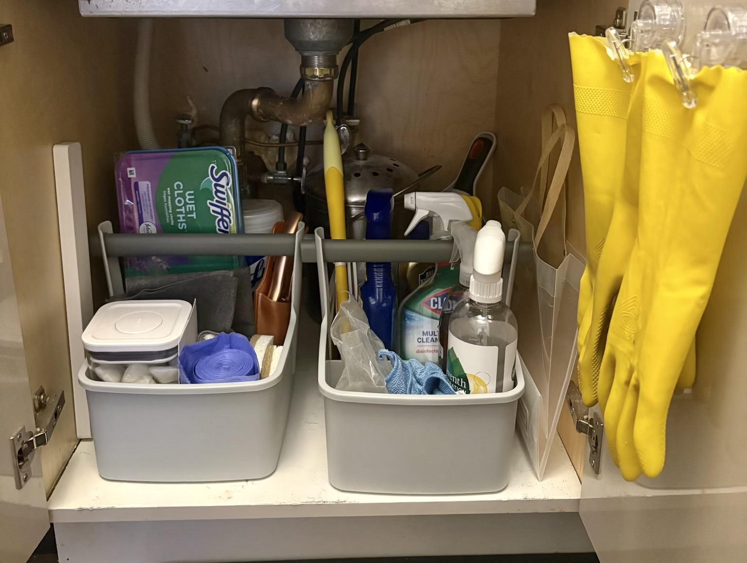 After: organized under-sink cabinet