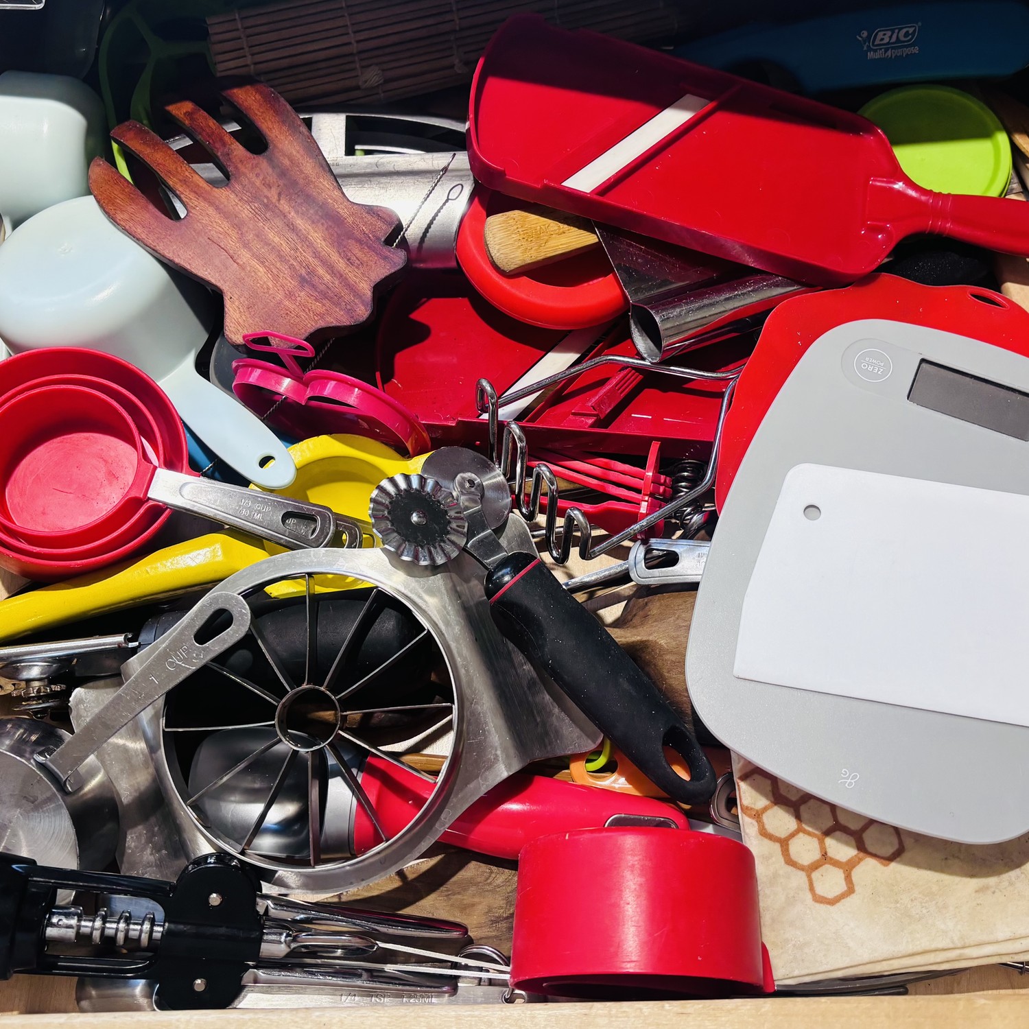Before: cluttered kitchen drawer