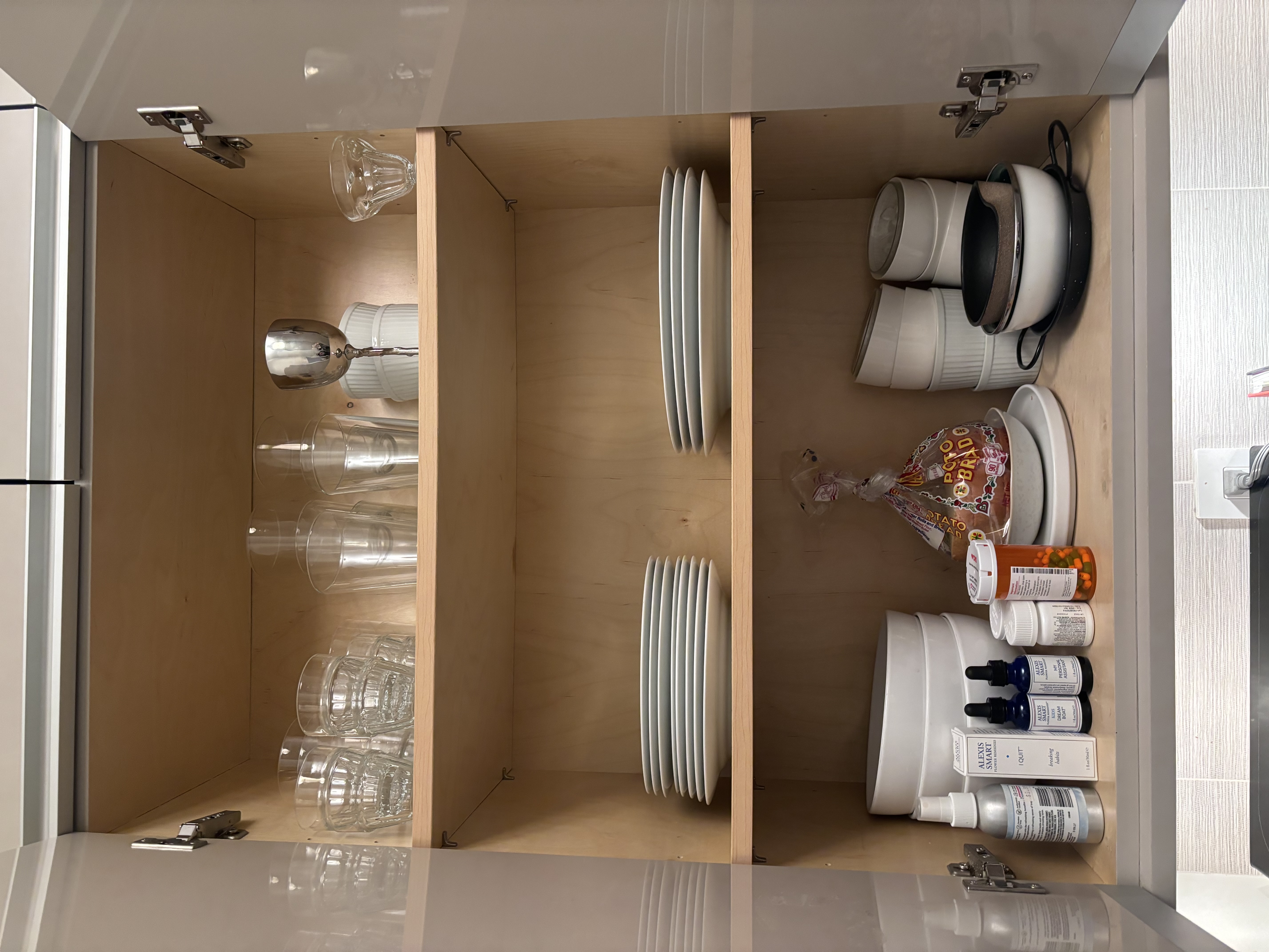 Before: cluttered cabinet